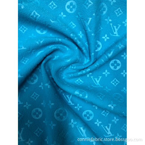 Polaire polaire 100% polyester avec motif LV en relief